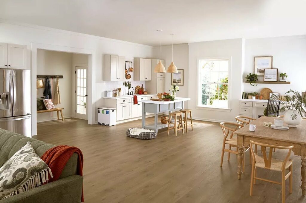 Open concept kitchen and dining area with waterproof luxury vinyl plank flooring for busy family homes