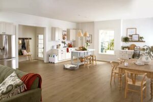 Open concept kitchen and dining area with waterproof luxury vinyl plank flooring for busy family homes